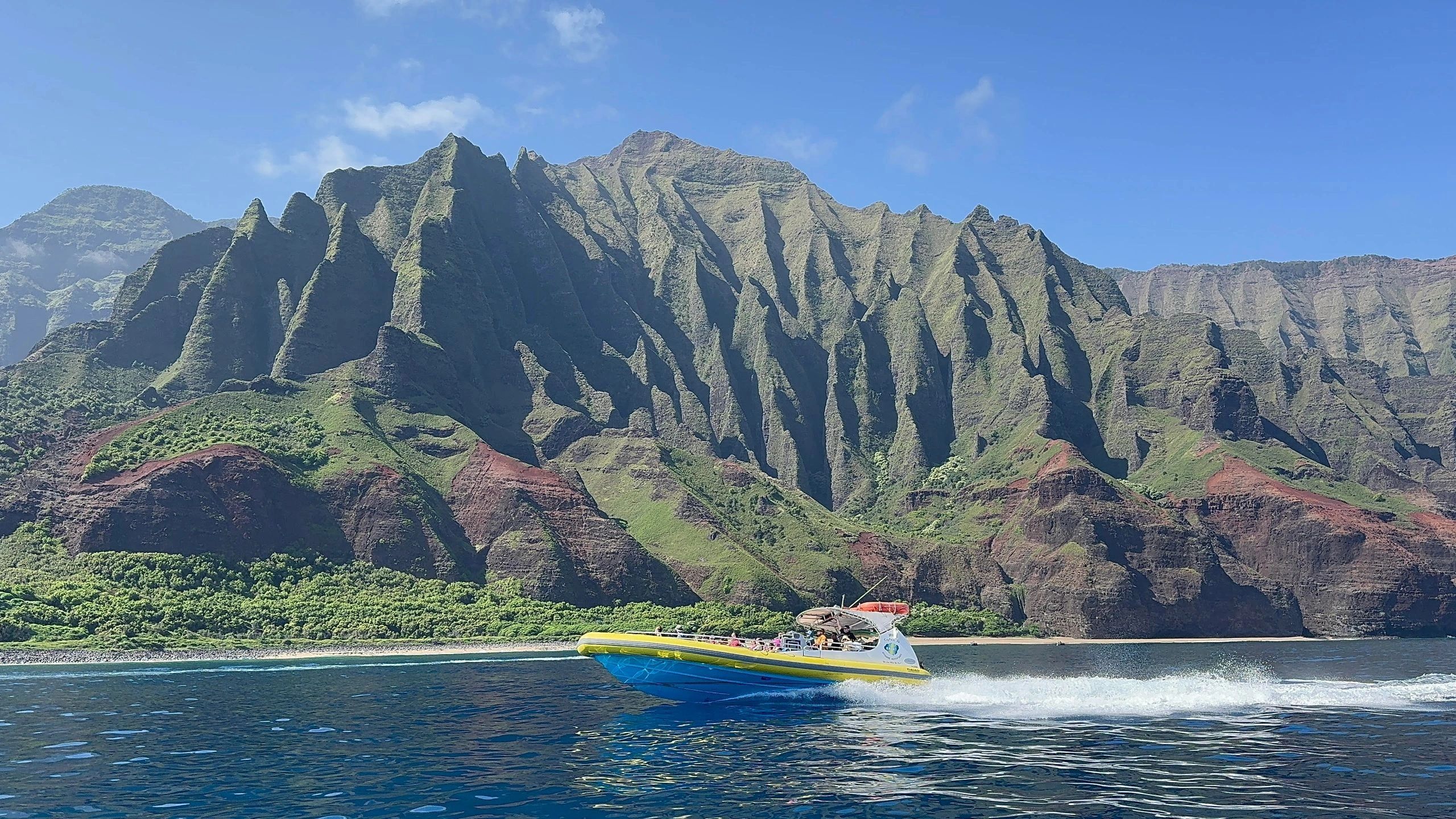 A super raft travels along the Na Pali Coast